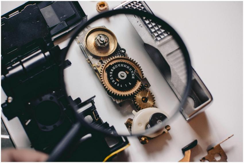 Intricate gears of a camera mechanism magnified, s