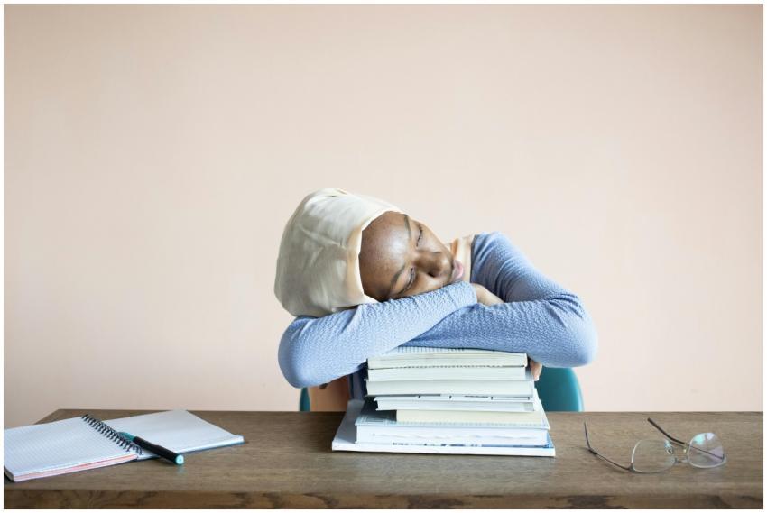 Sleeping African American female student in headsc