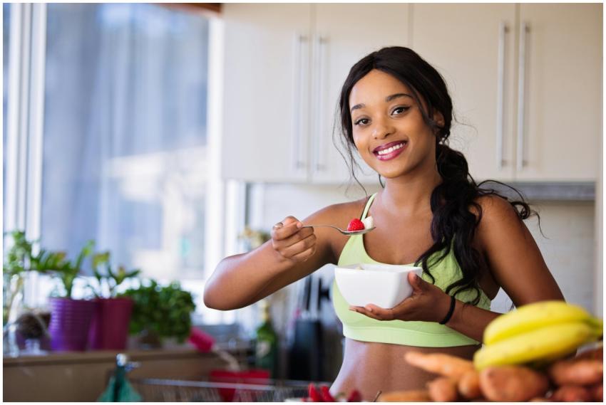 Smiling young woman in sportswear enjoying a healt