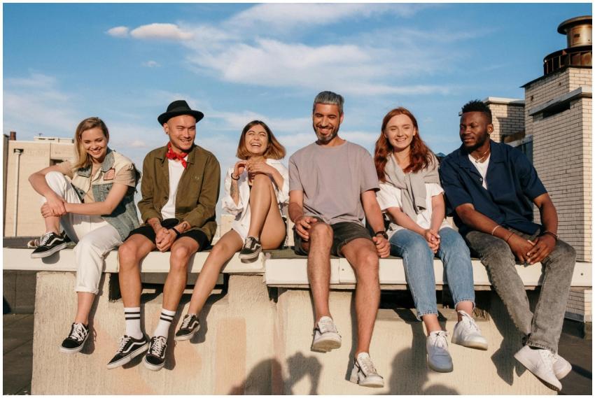 Diverse group of friends laughing and relaxing on