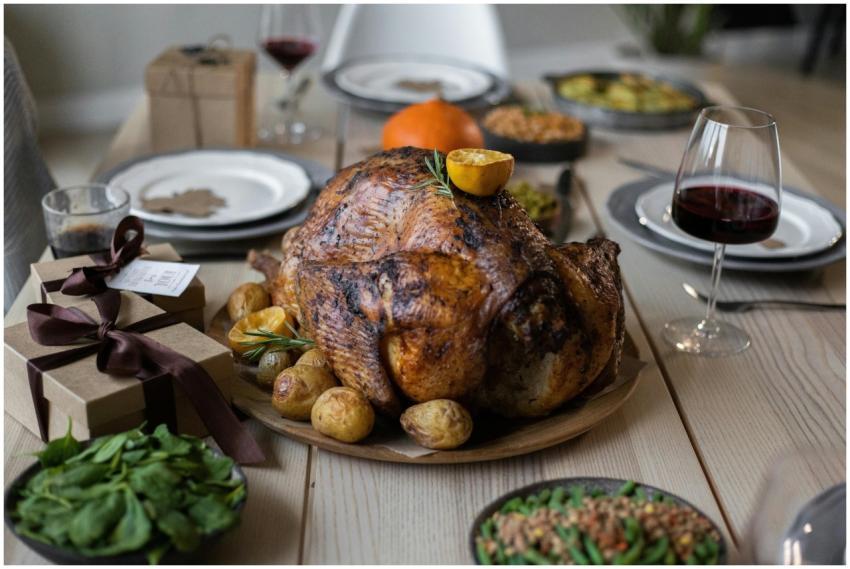 High angle of appetizing roasted turkey and glasse