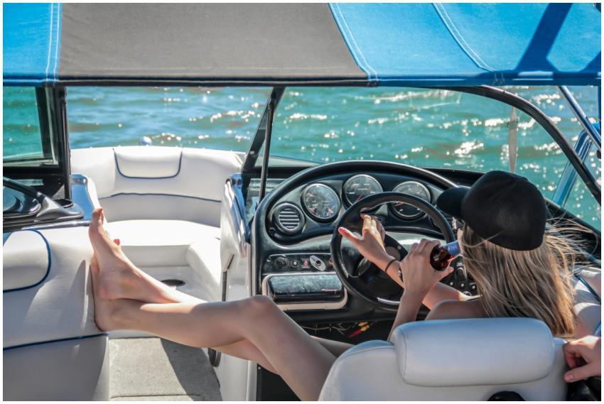 A woman enjoys a sunny day on a luxury boat, relax