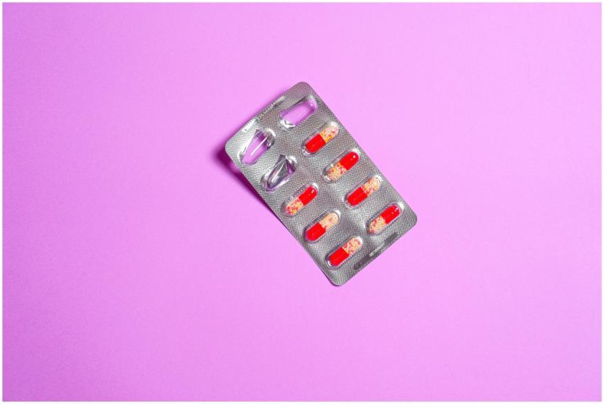 Close-up of a blister pack containing red capsules