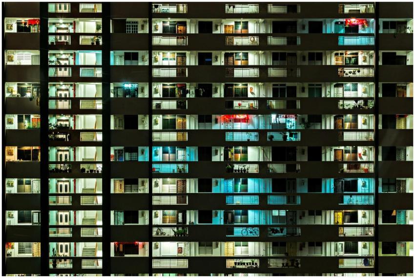 Night view of a modern apartment building with ill