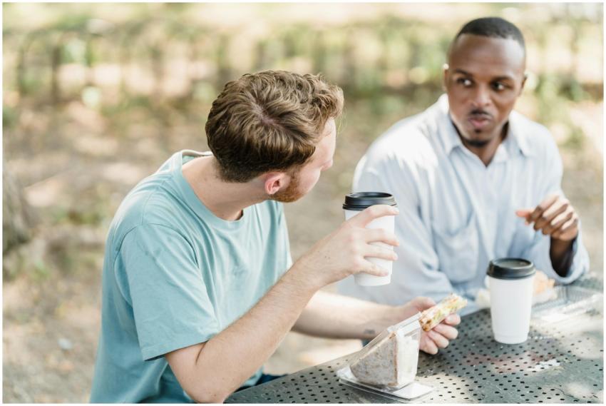 Two men chatting and enjoying coffee together at a