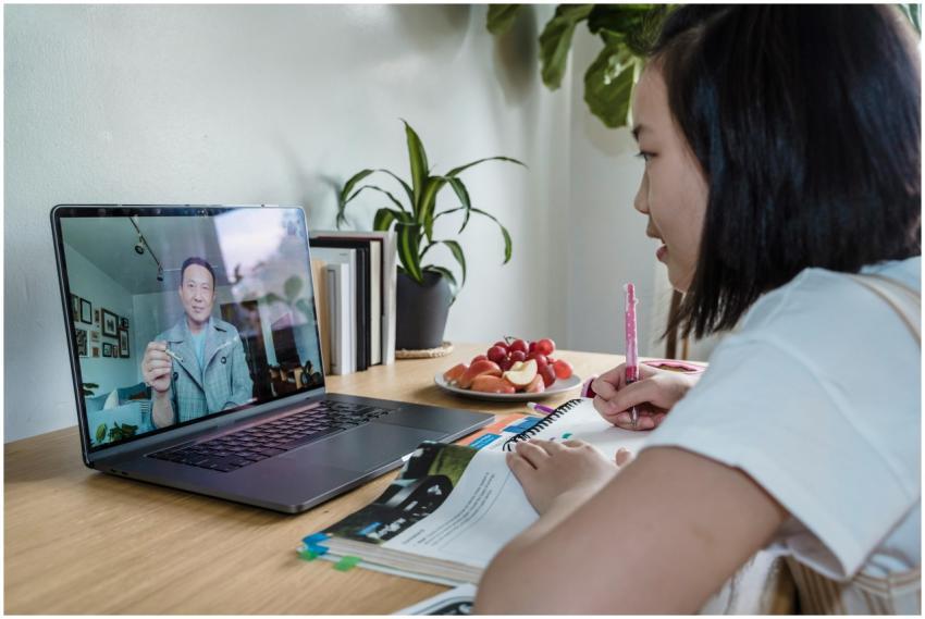 Young girl engaged in online learning via video ca