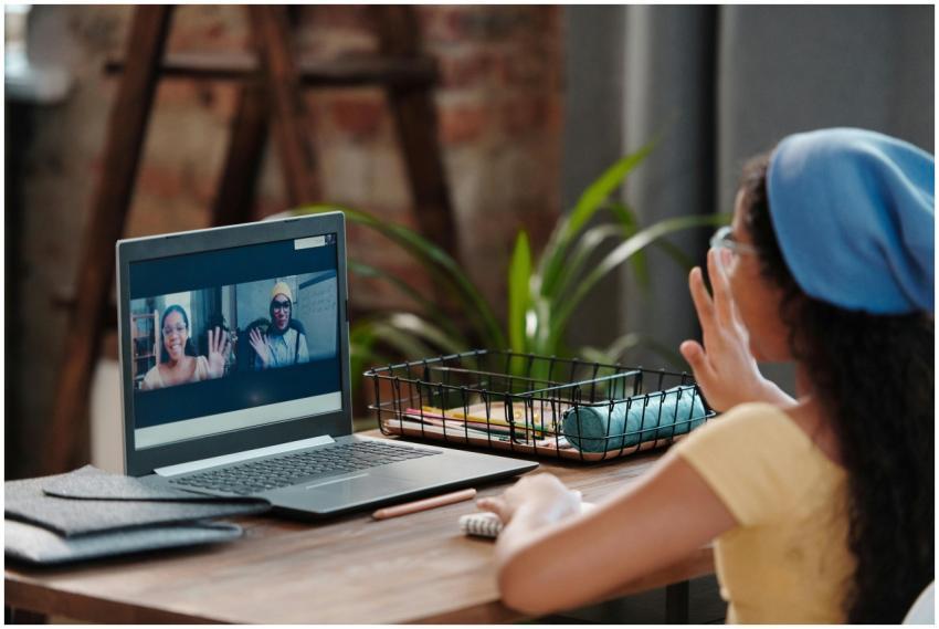 Young girl engaging in an online class from home,