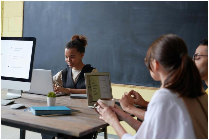 Group of young adults engaged in digital learning