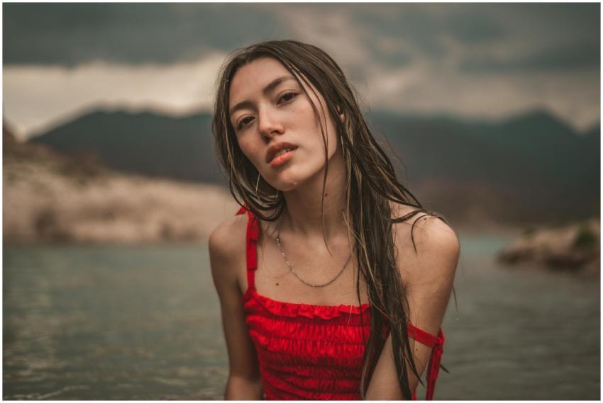 A captivating portrait of a woman in a red dress b