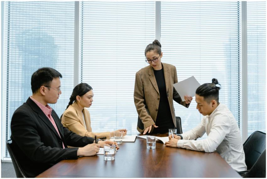 Business colleagues engaged in a meeting around a