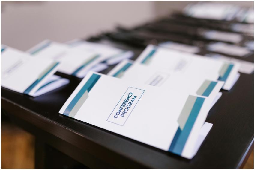 Close-up of conference program booklets neatly arr