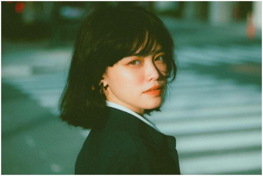 Side view of confident young Asian female entrepre