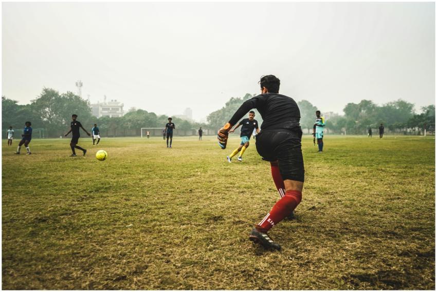 Energetic soccer game with players on a grassy fie