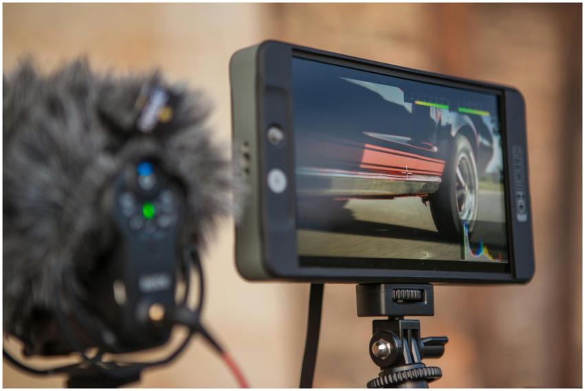 Close-up of a video monitor recording a car, showc