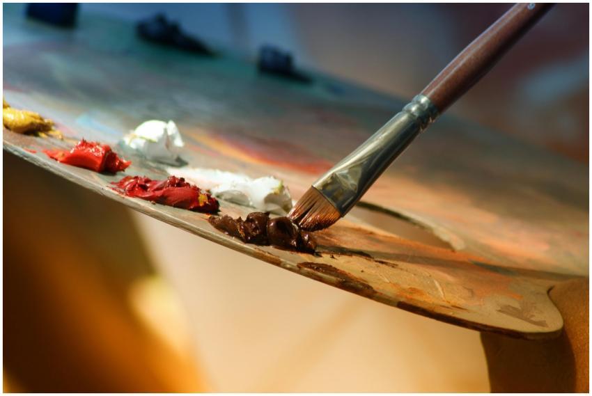 Vibrant artist palette with paint and brush creati