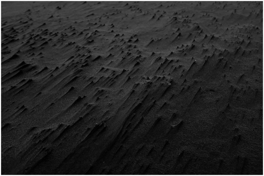 Abstract black sand texture creating a dramatic an