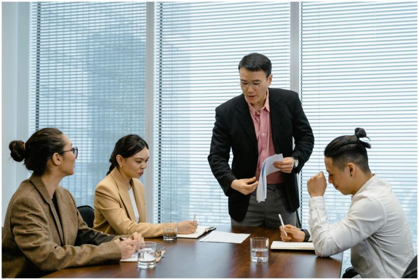 A diverse group of adults engaging in a business m