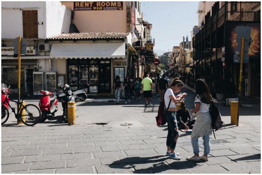 Street view of Chania, Greece featuring people, sh