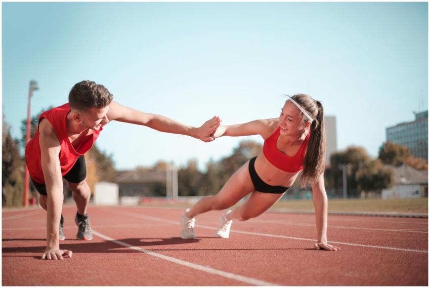 Outdoor workout featuring a man and woman engaging