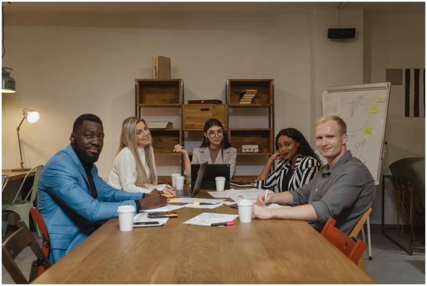 A diverse group of professionals engaged in a prod