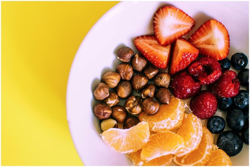 Close-up of a bowl with fresh fruits and nuts agai