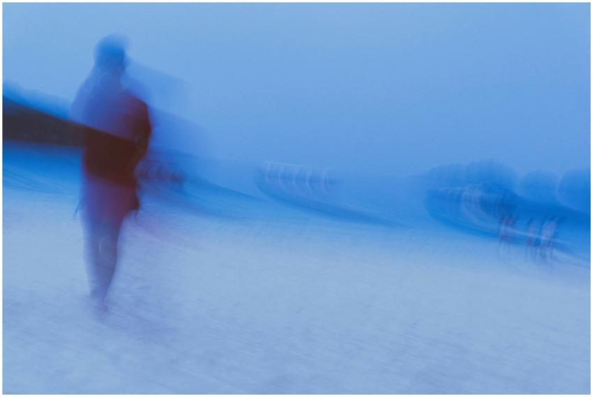 Artistic capture of a blurred silhouette walking o