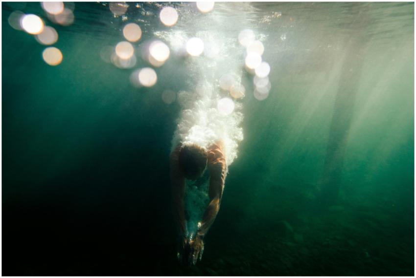 Dynamic underwater shot capturing a diver in motio