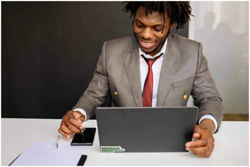 Young African American businessman working on lapt