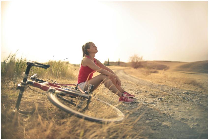 Full body of female in shorts and top sitting on r