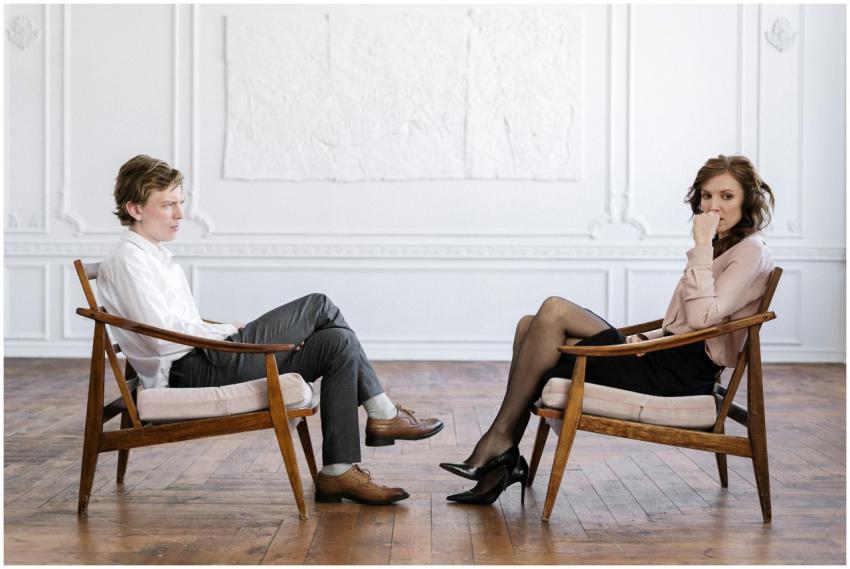 Man and woman in professional consultation setting