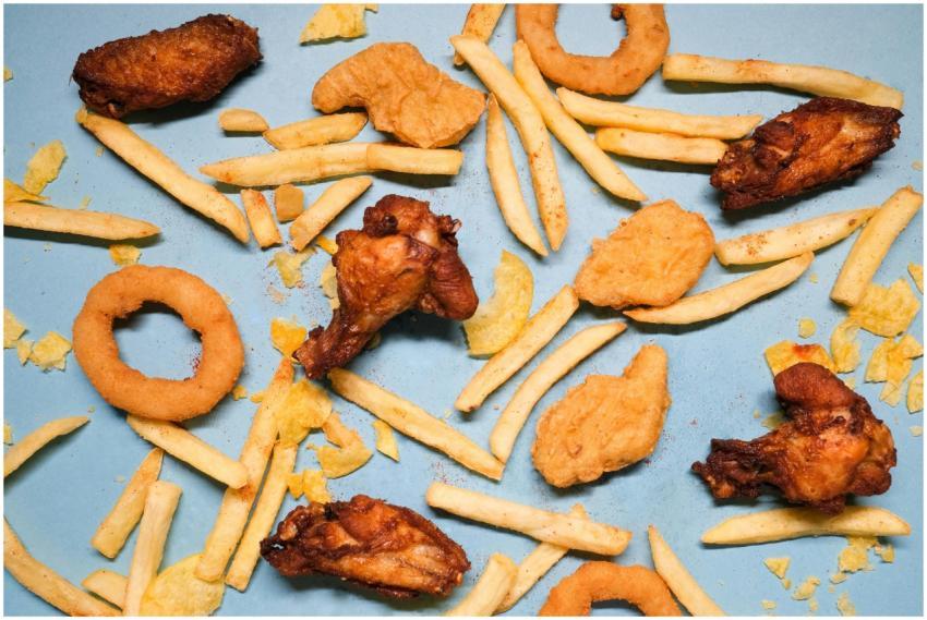 Flat lay of assorted fried snacks including chicke