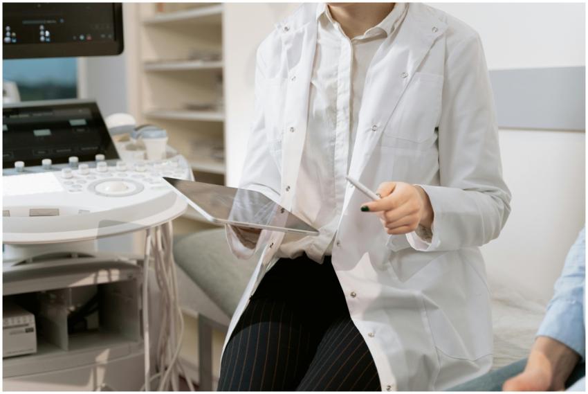 Doctor holding a tablet in a modern medical office