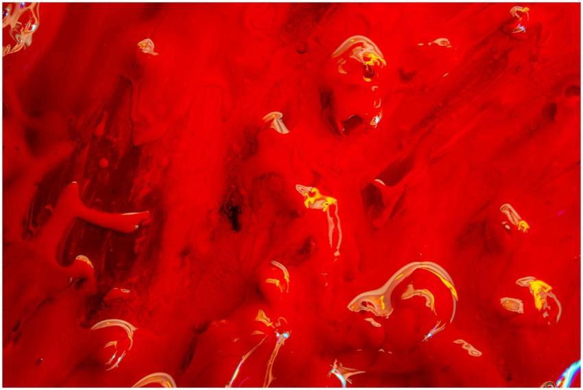 Dynamic and vibrant red abstract artwork with glos