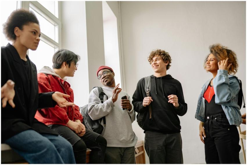 A lively group of diverse students chatting and in