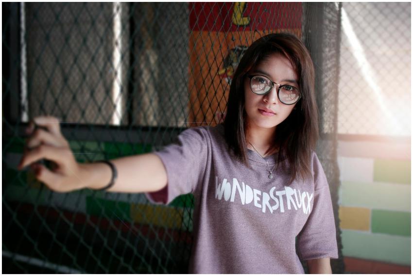 Portrait of a young woman wearing eyeglasses and a