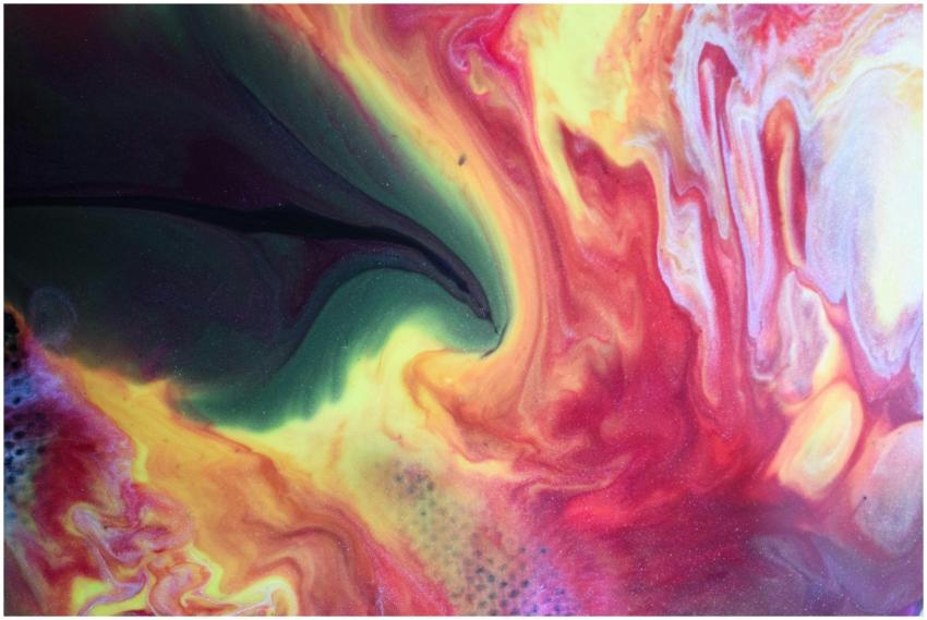 Dynamic fluid art featuring vibrant swirls of red,