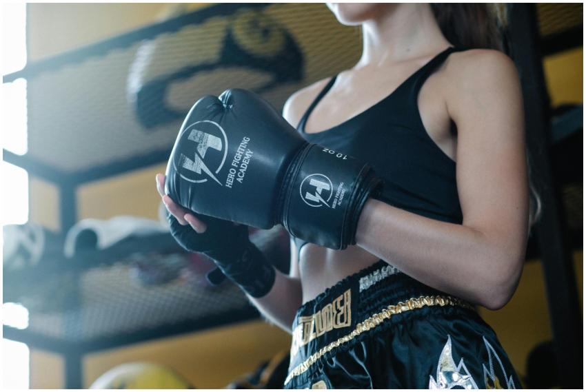 From below of crop slim lady wearing activewear an