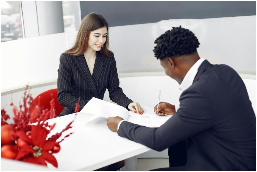 A professional setting with two business people si