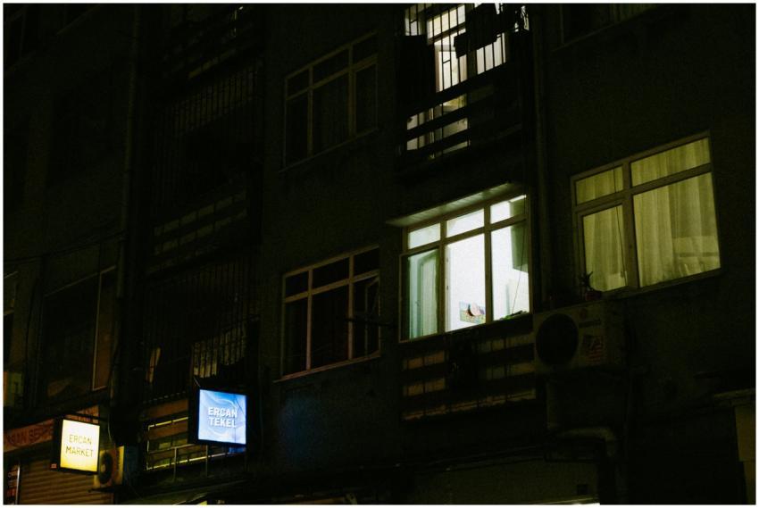 Night view of an illuminated urban apartment build