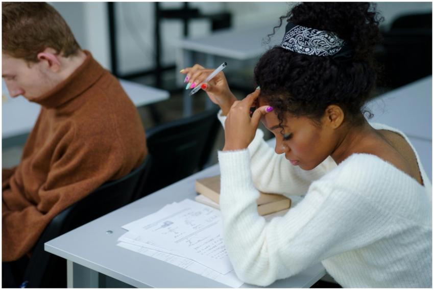 Concentrated student taking an exam in a classroom