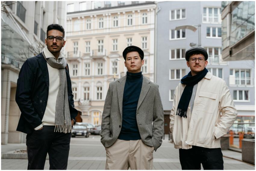 Stylish men posing confidently in an urban street