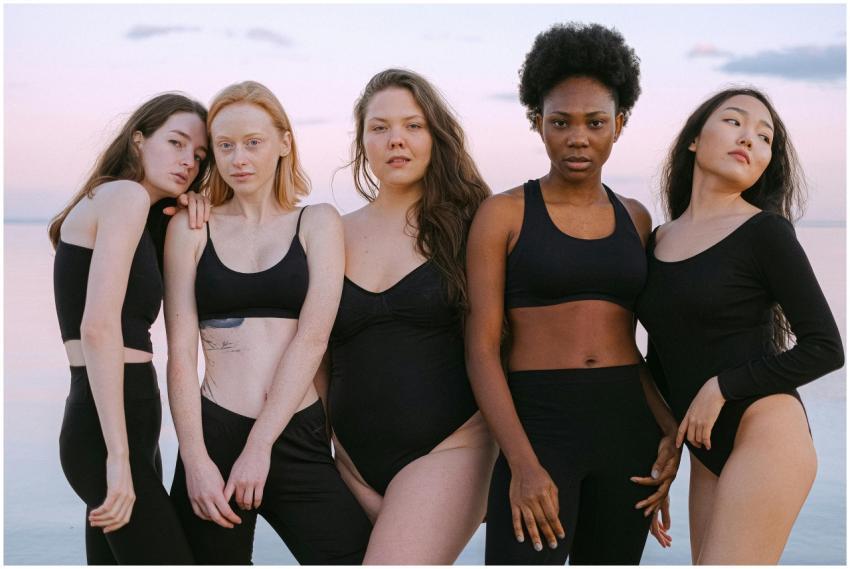 Portrait of diverse women in black activewear stan