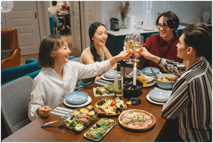 A lively gathering of friends sharing a meal, rais