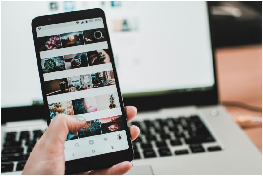 A person uses a smartphone to browse social media