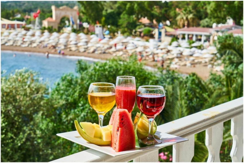 Tropical drinks and fresh fruits on a balcony over