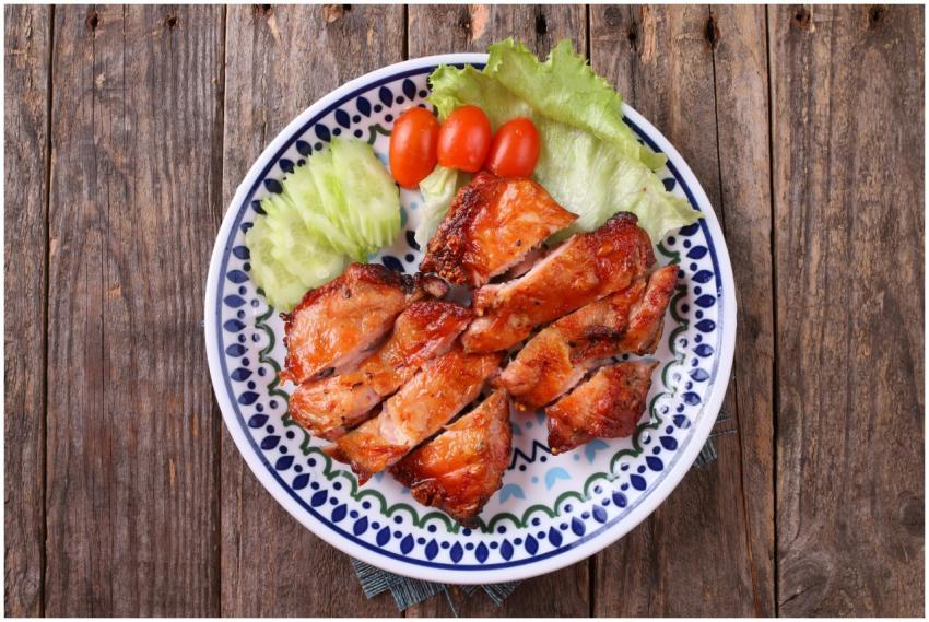 Tasty grilled chicken served with lettuce, tomato,