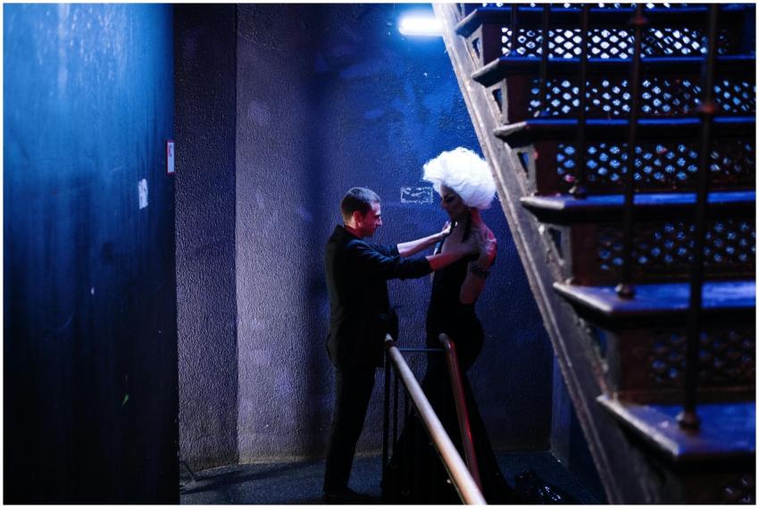 A striking moment between two individuals in a dim