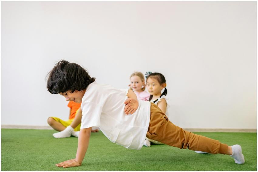 Group of children having fun and exercising indoor