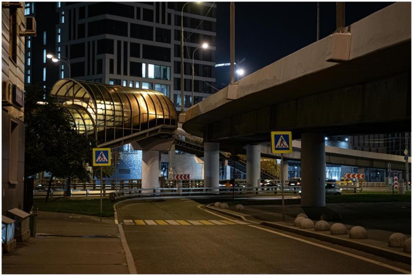 Illuminated overpass and city architecture capture