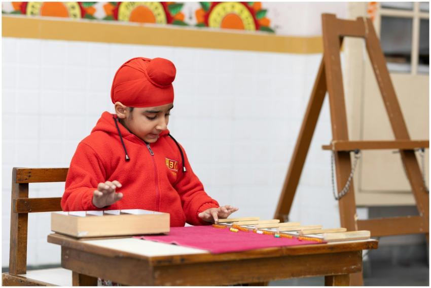 Young child in a classroom setting, engaging with